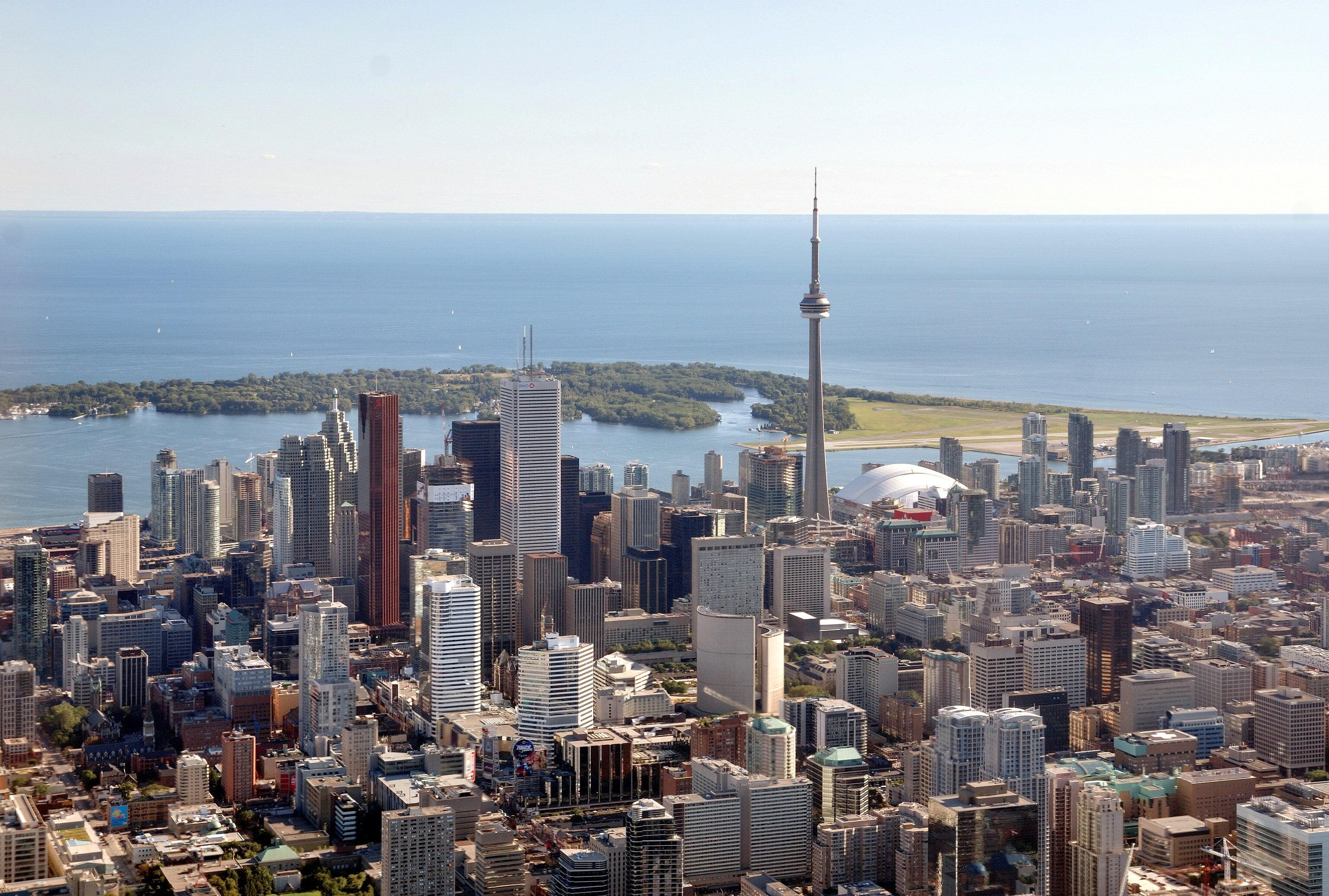 Toronto - Aerial view of downtown Toronto (from helicopter), with view of Toronto Islands and Lake Ontario in the background.