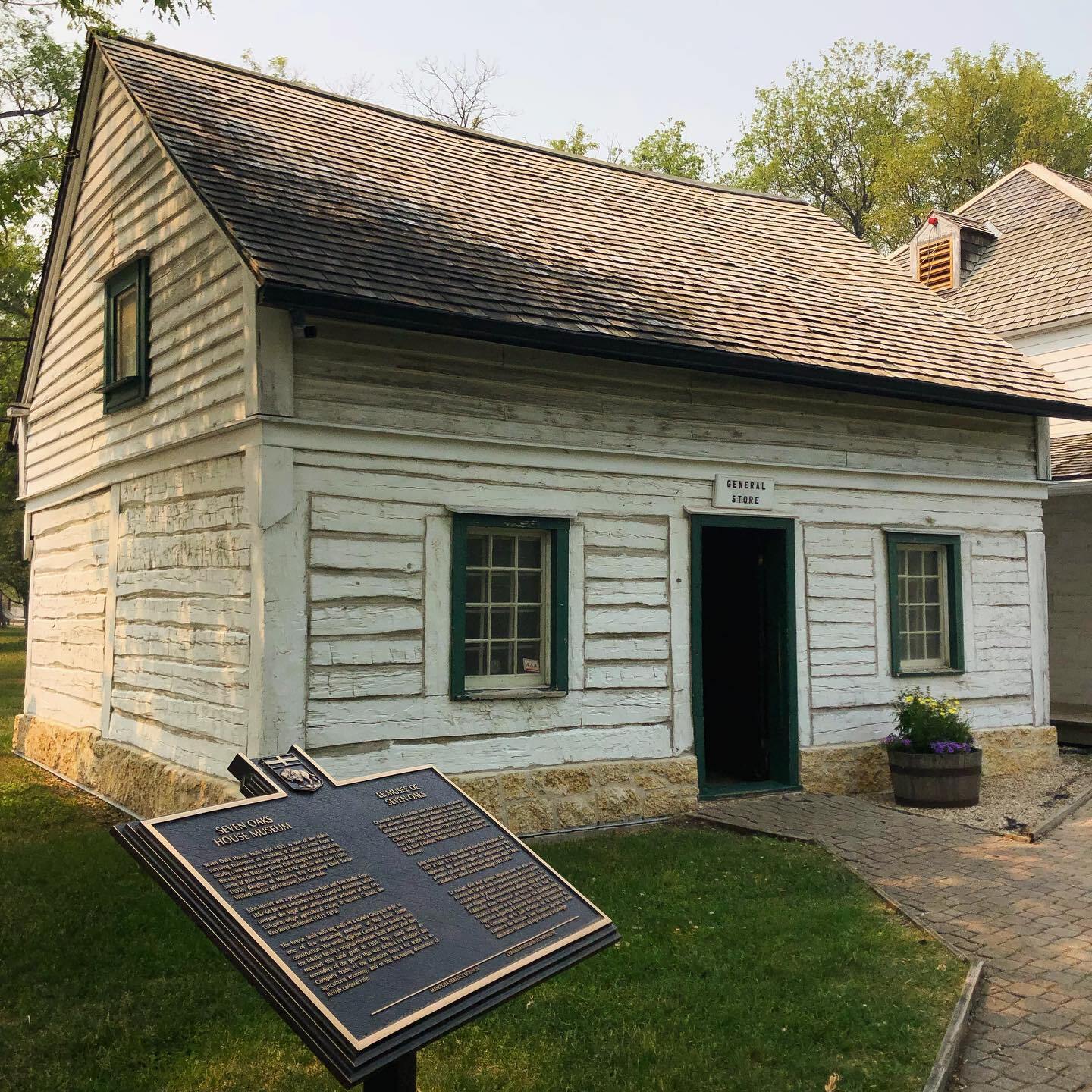 John Inkster's General Store (built c.1831) and historic marker at Seven Oaks House Museum Provincial Heritage Site in Winnipeg, Manitoba.