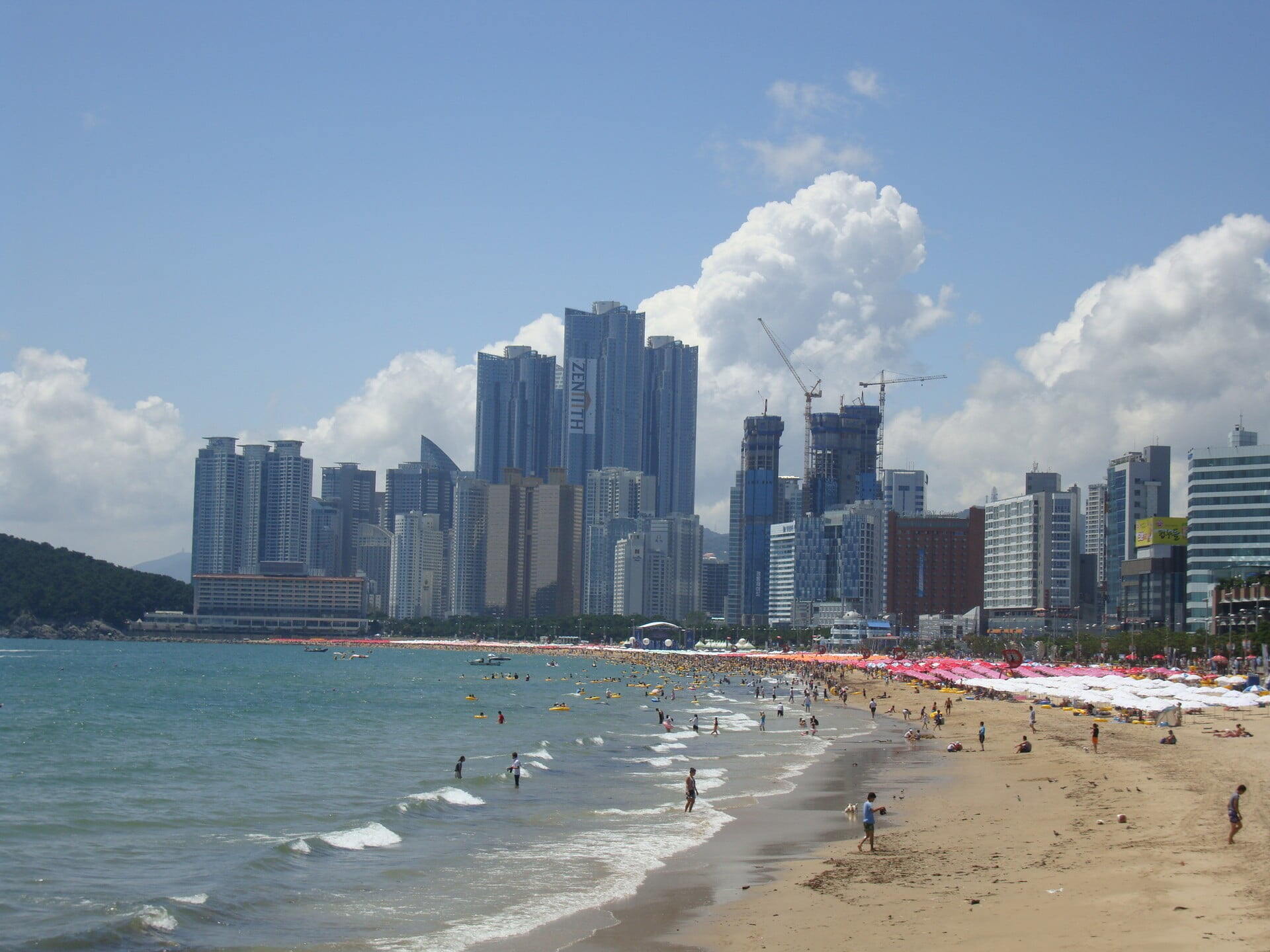 Pusan - Afternoon in Haeundae Beach, Busan, South Korea. Photograph from Flickr; author Jens-Olaf Walter; license of cc-by-2.0.