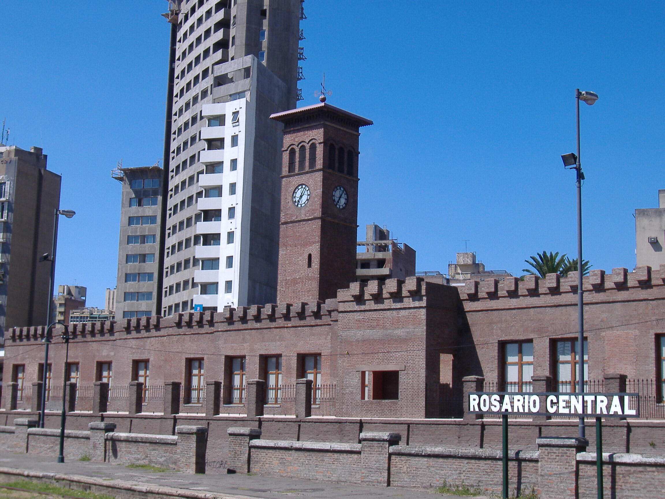 The clock tower of the former Rosario Central railway station in Rosario, Argentina, built in 1870, view from the platforms. The main building has…